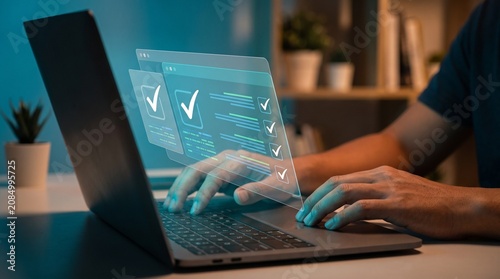 Photos Person using laptop with virtual checklist interface for online task management,