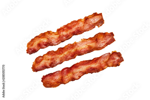 Quadro su tela Three crispy smoked bacon strips isolated on a white background, arranged diagonally with appetizing golden-brown color, crisp edges, and rich meaty texture