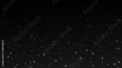 Abstract glitter lights on black background.