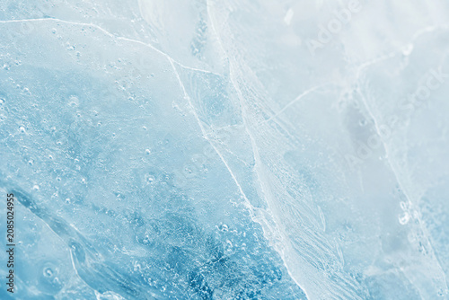 Macro Natural Ice Texture with Cracks and Frozen Bubbles