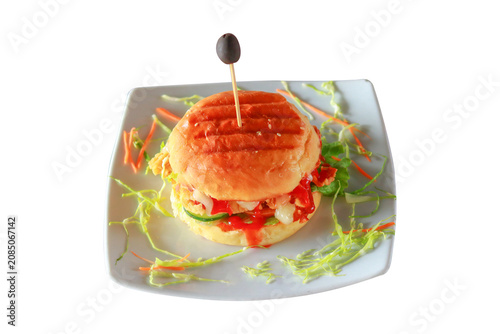 Gourmet Chicken Burger with Olive and Fresh Garnish on White Background