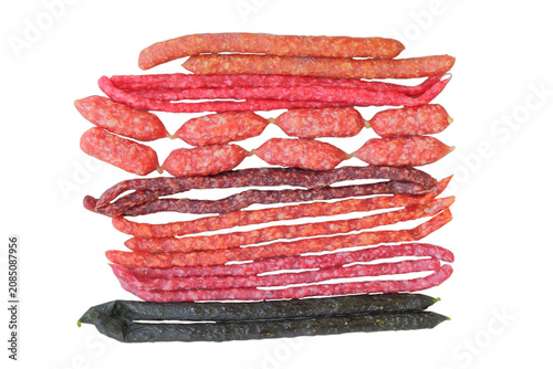 Variety semi-dry sausages. Top view. Raw cured sausages on a white background.