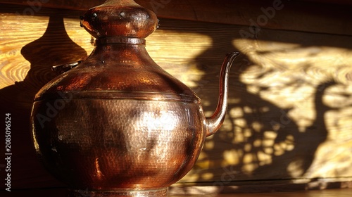 armagnac. Copper pot still gleaming in soft sunlight in a rustic workshop. safety posters, maintenance manuals, designed for precision metalworking and fabrication facilities.