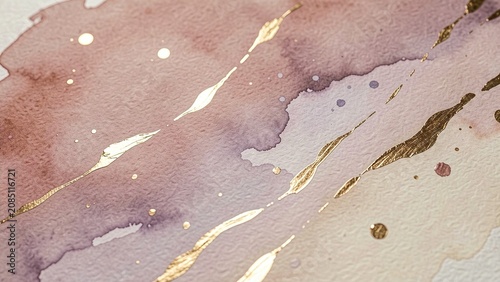 A close up of a purple and gold watercolor painting