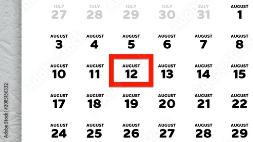 Close-up of August 12th date marked with a red cursor on a 2026 wall calendar