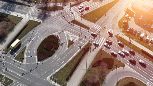 Quadro su tela Aerial city junction with multiple lanes and vehicles