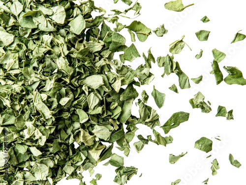 Dried Chopped Bitter Gourd Leaves with Fanned Out Pieces on a Black Background