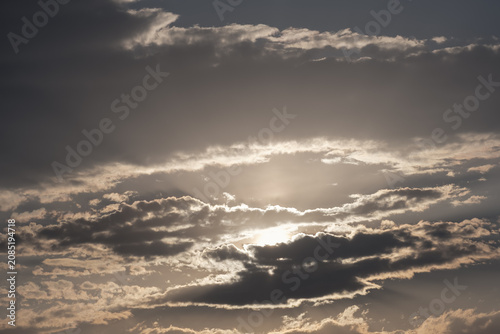 Sun rays dramatic sky bright clouds glowing through overcast creating powerful natural background for weather and nature concepts