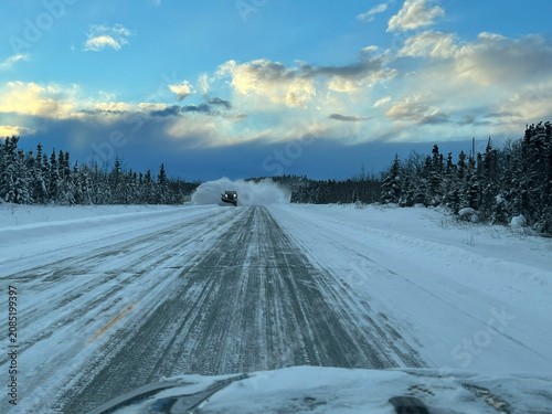 Snow plowing on highway in Alaska