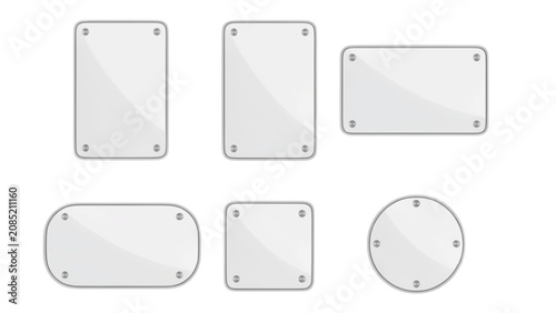 Set of six various white rectangular and circular glass plates with metallic silver screw fasteners at corners on a white background