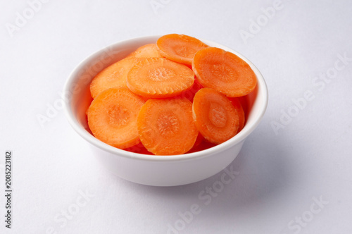 Sliced raw carrots as an ingredient in a salad or soup