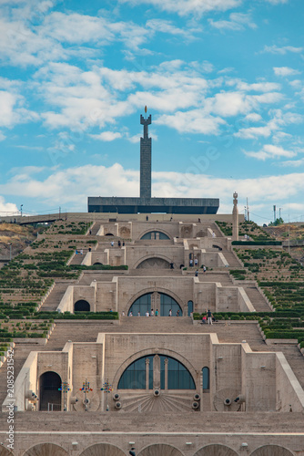 Symmetric view of Yerevan Cascade complex with monument under cloudy sky with copy space