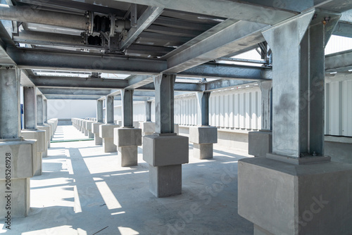 Concrete support pedestals on industrial rooftop