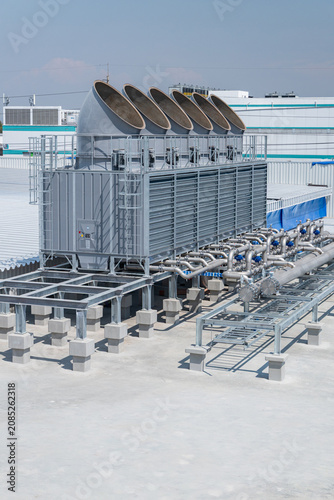 Large industrial cooling tower on building rooftop