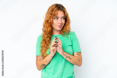 Young caucasian woman isolated on white background scheming something