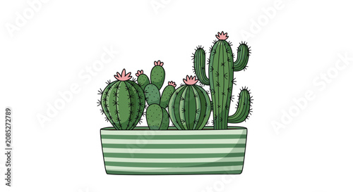 Various green cacti and succulents with small pink flowers planted together in a modern green striped rectangular ceramic container.