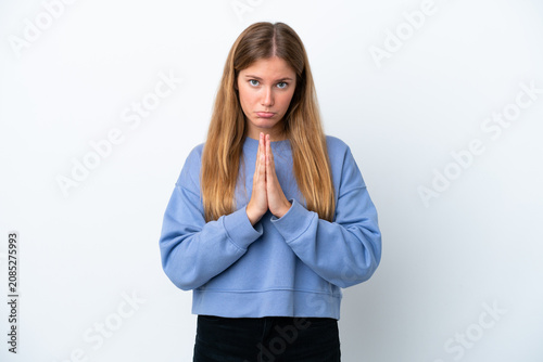 Obraz na płótnie Young blonde woman isolated on white background keeps palm together