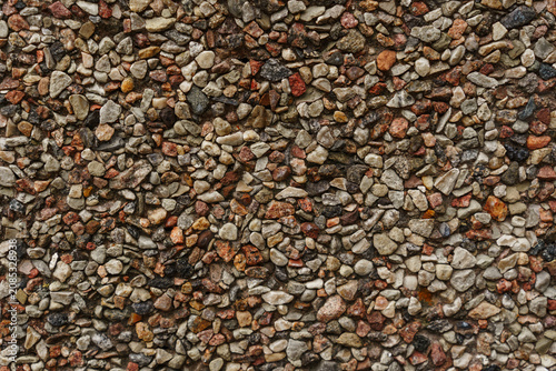 Bild auf Leinwand Natural pebble stone texture wall surface with earthy brown and grey tones for i