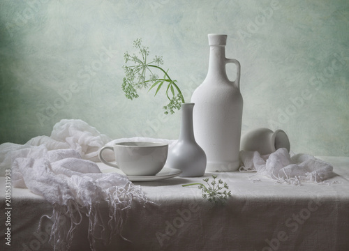 Принти на полотні Contemporary still life with a flower and white dishes on a light background
