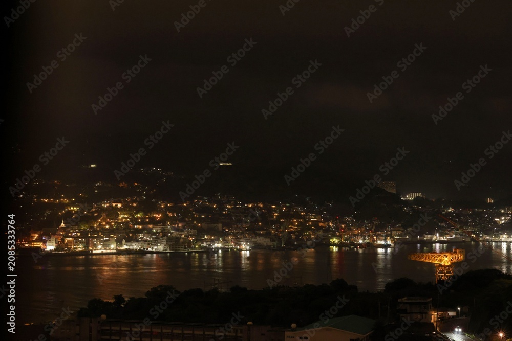 Fototapeta premium Night View of Nagasaki Harbor with Mitsubishi Giant Cantilever Crane, Japan