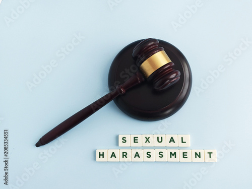 Gavel with letters spelling sexual harassment