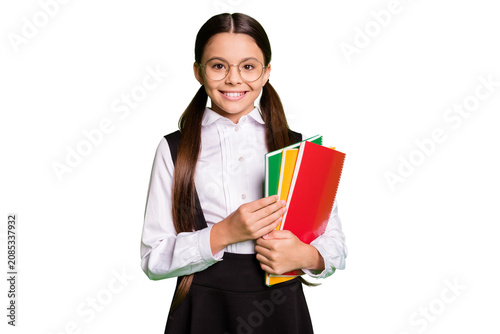 фотографія Photo of cute charming little lady in front of blackboard hold pile copybook too