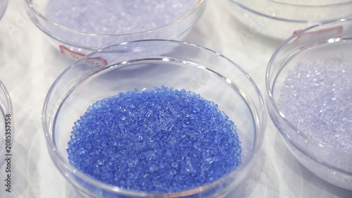Close up of blue transparent polymer resin pellets