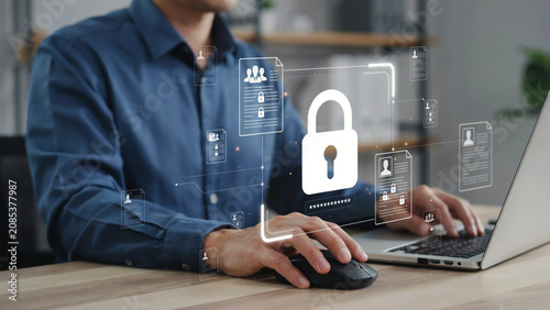 Businessman using laptop with virtual security padlock icon, cybersecurity and data protection concept