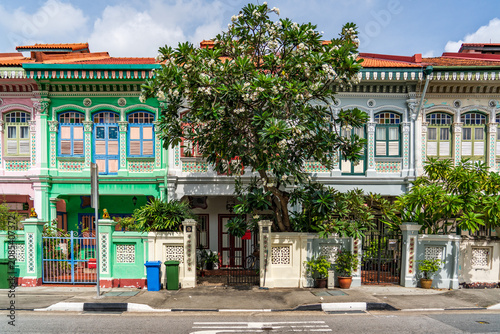 Front facade view of the iconic colorful pastel Peranakan shophouses on Koon Seng Road in Katong, Singapore