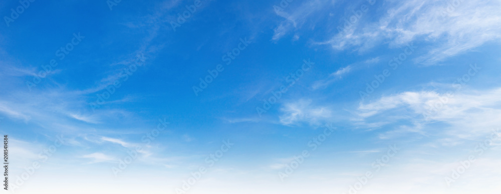 Fototapeta premium Vast blue sky stretches across the frame