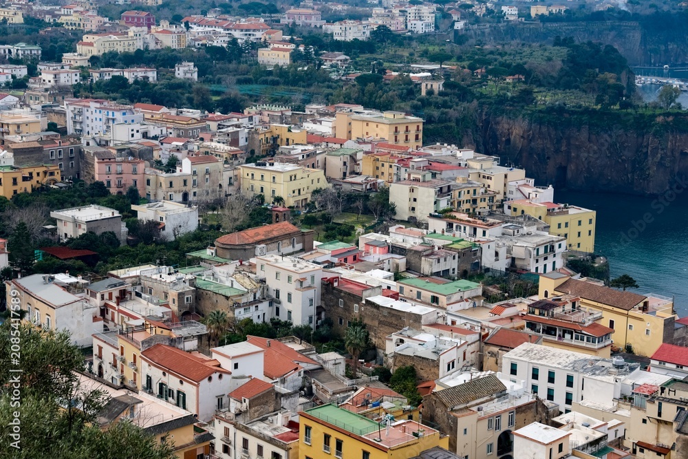 Fototapeta premium Sorrento, Italy - 06. March 2026: Sorrento main town buildings along the coast in Italy