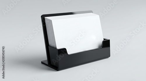 White flyers stack mockup in black glass plastic holder isolated on light grey background