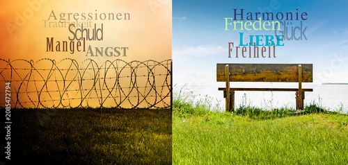 Konflikt und Frieden dargestellt an einem Stacheldrahtzaun und grünem Feld in...