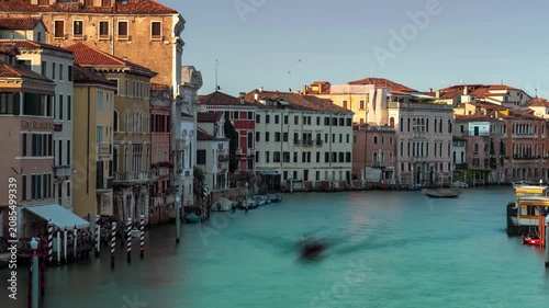 Venice Grand Canal cityscape time lapse with traditional historic architecture and moving shadows over water during golden hour sunset