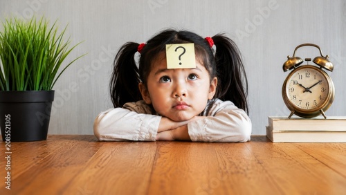 A thoughtful child with a question mark sticky note on her forehead looks up, surrounded by a plant, clock, and books, conveying curiosity and contemplation.