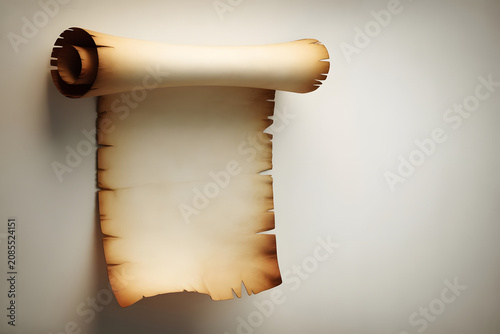 Old parchment scroll with burnt edges on white background