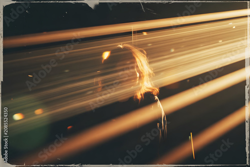 Silhouette of a Person with Light Trails in a Dark Environment