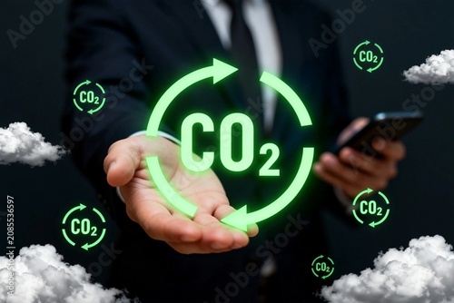Businessman Holding CO2 Cycle Icon
