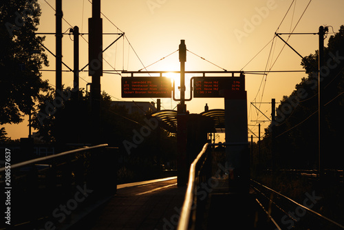 Sunset over tram station during the Europe summer 2026 heat wave with glowing skyline