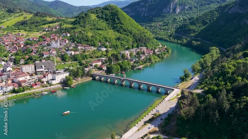 Visegrad, Bosnia and Herzegovina – May 30, 2026: High aerial view of Mehmed Pasha Sokolovic Bridge connecting both sides of Visegrad above the Drina River