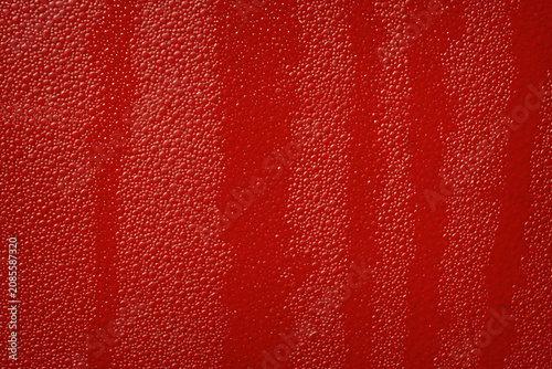 Schilderij op canvas Abstract vivid red textured background featuring soft vertical gradient stripes and a fine granulated surface pattern, ideal for commercial microstock design backdrops