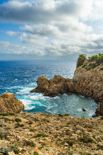Beautiful Mediterranean coastline with turquoise sea and rugged rocks in Mallorca. European island landscape, scenic travel, relaxation and nature tourism concept.