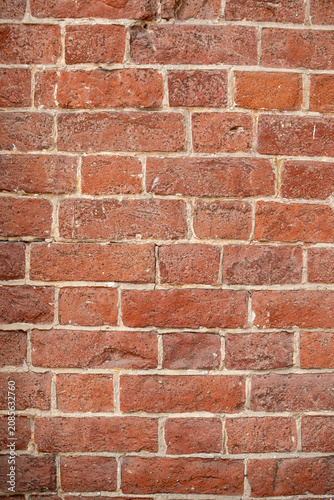 Aged red brick wall texture vertical pattern background