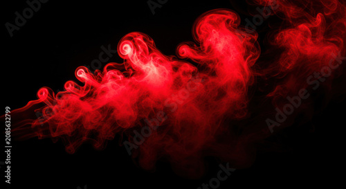 Red smoke swirls dramatically across a black background. The flowing smoke creates an abstract and dynamic composition, resembling a fiery ribbon.