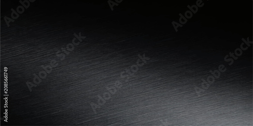 Foto A dark, brushed metal surface with subtle diagonal scratches, reflecting a soft, diffused light across its textured expanse