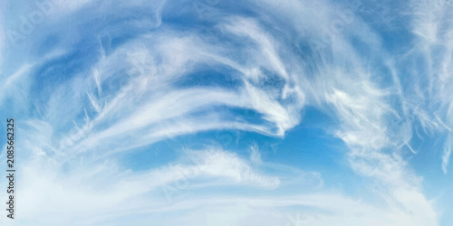 Canvastavla Wispy cirrus clouds paint abstract strokes across a vibrant blue sky, creating a sense of boundless space and ethereal beauty