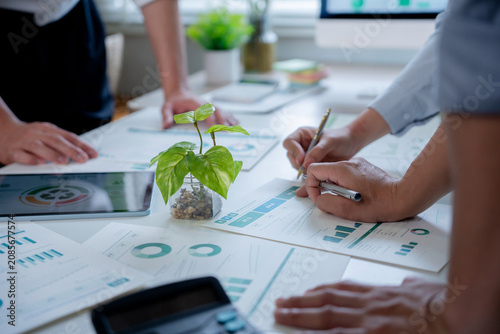 Business team analyzing ESG data for sustainable investment