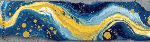 Dynamic blue and yellow marbled paint with golden specks, concrete edge. Ideal for backgrounds, covers, web design, or luxury branding.