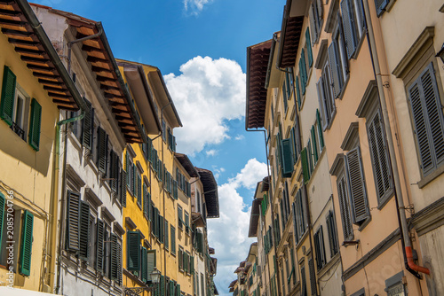 Yellow exterior of apartment buildings in the city of Florence italy