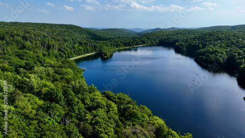 Stunning aerial background of the Canopus Lake in Putnam County, New York, part of the Lower Hudson Valley. Drone photography above lake and river systems